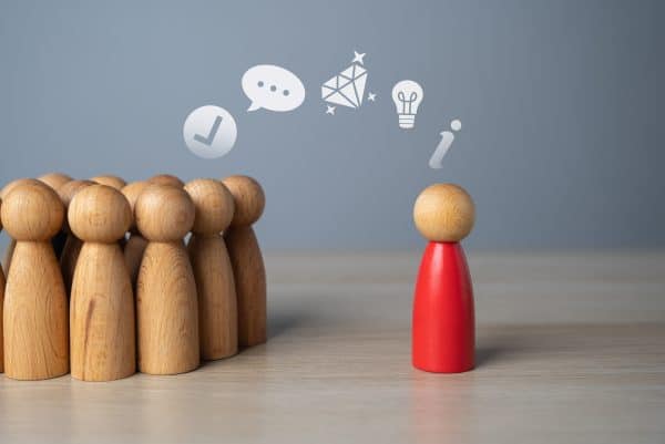 Leader giving inspiring team presentation – representing standout leadership behavior